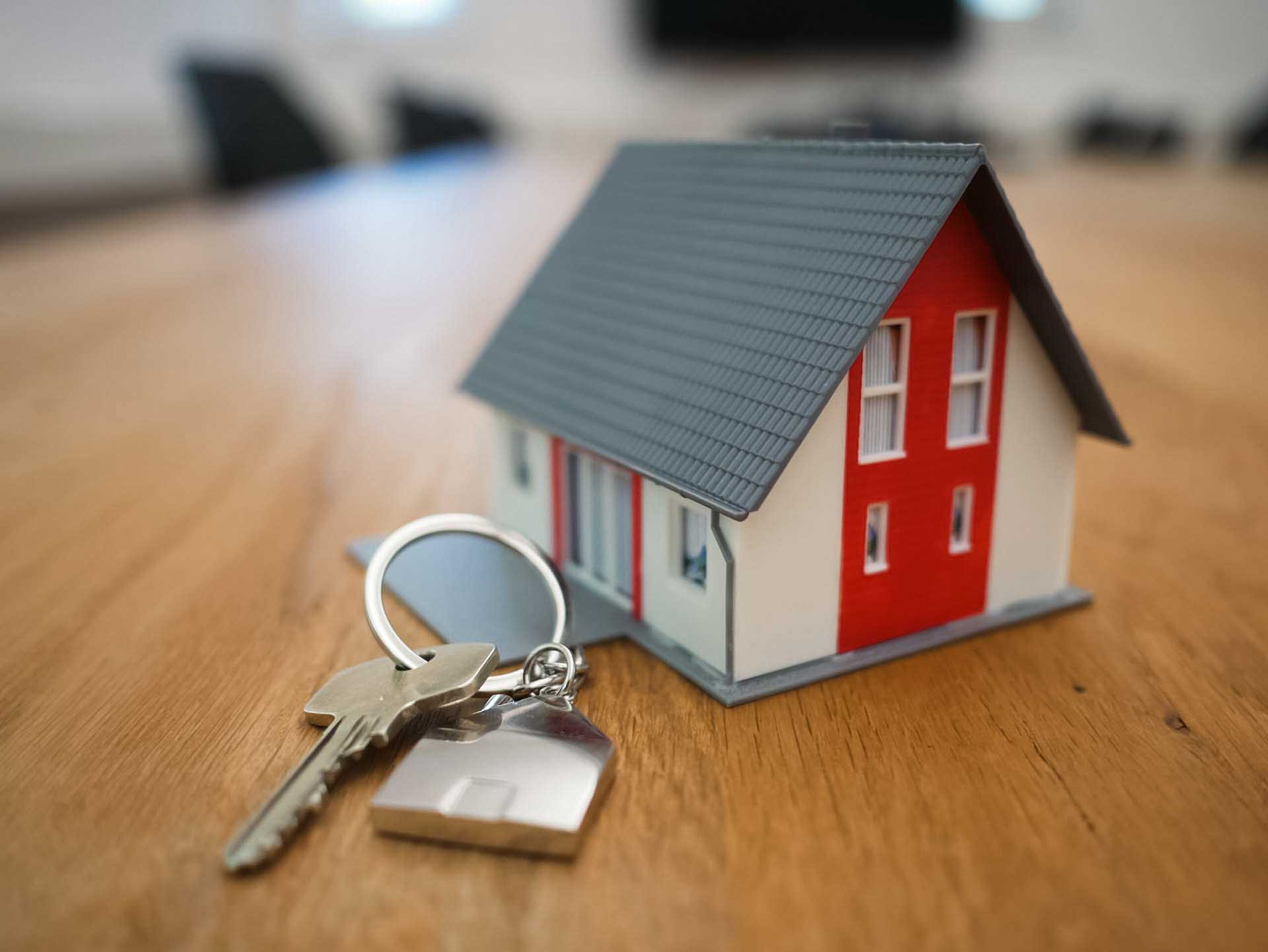 Small house with keys on table