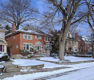 Street of traditional middle class single family houses on a sunny day in winter